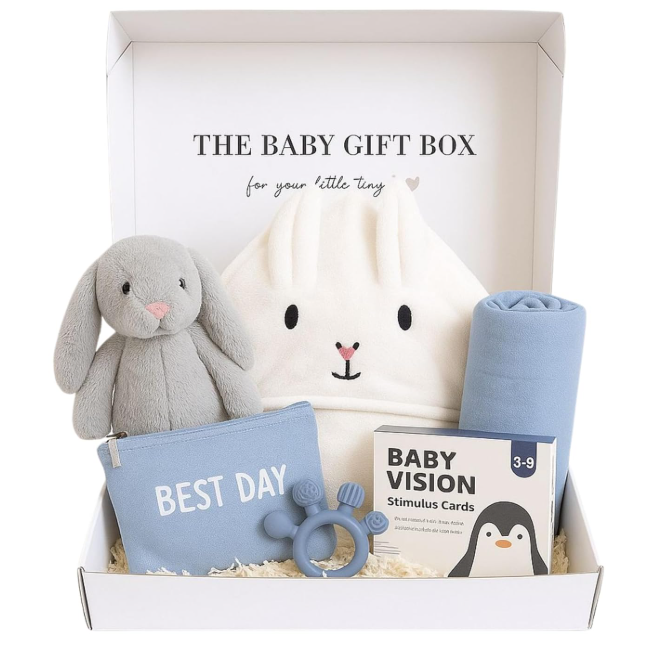 Baby gift box with plush toy, hooded towel, and baby items on a white background